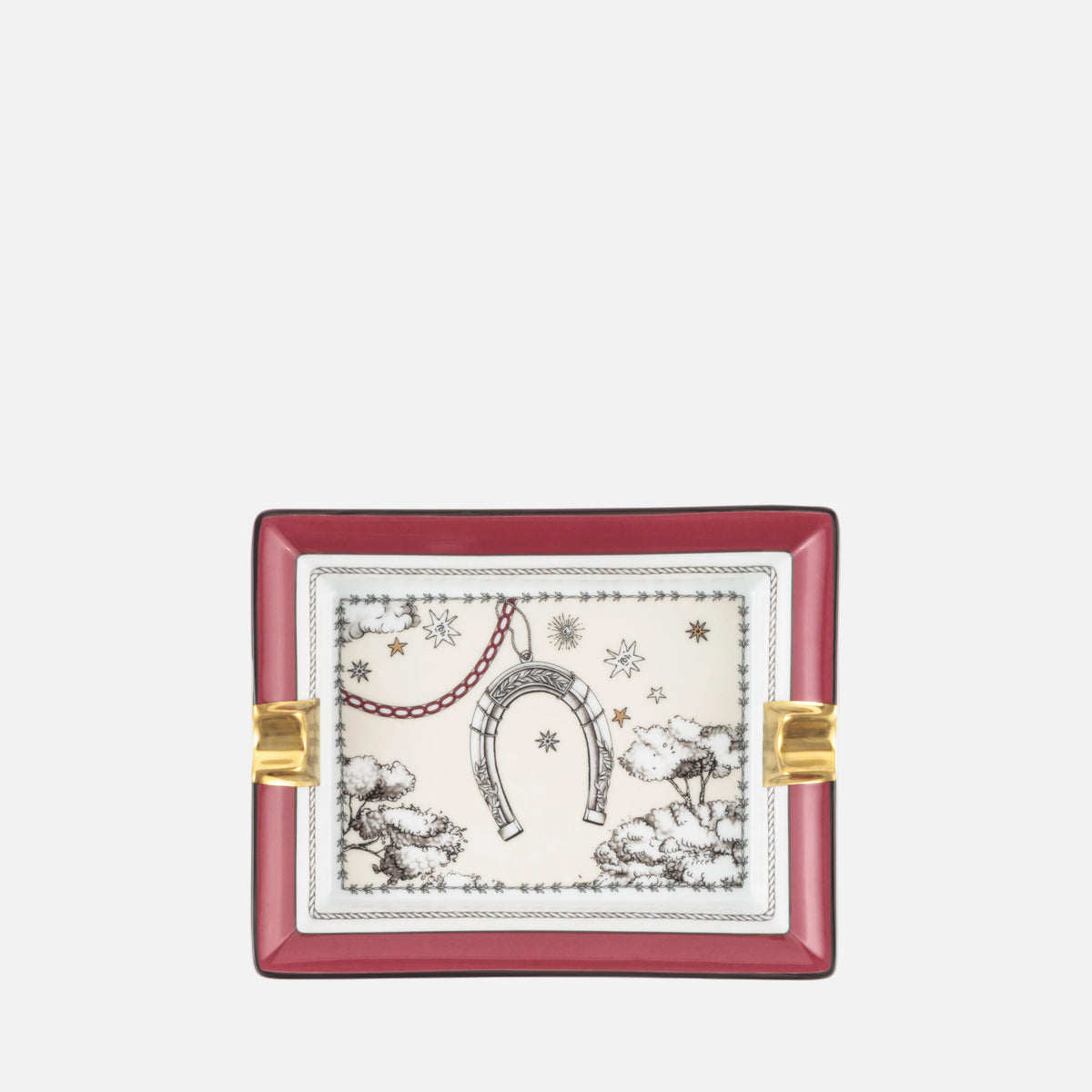 A square decorative tray with a deep red border, gold-toned side accents, and a central cream-colored panel featuring a black and red toile de Jouy-style illustration of a horseshoe, stars, and winter motifs.