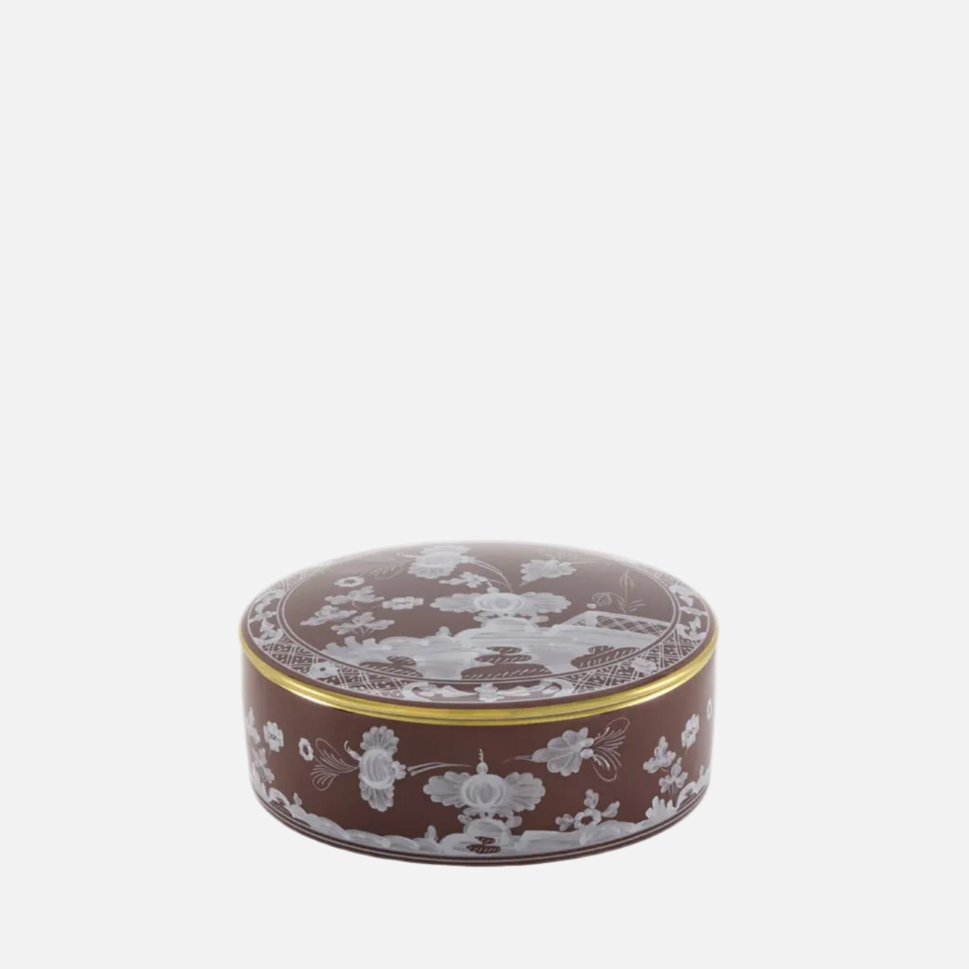 A round brown ceramic lidded box with white floral and bird motifs and a thin gold band, shown on a plain white background.