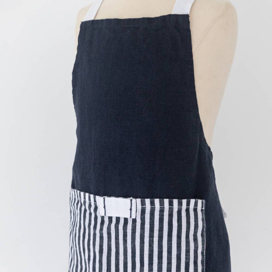 Navy apron with white striped pockets on a mannequin against a white background
