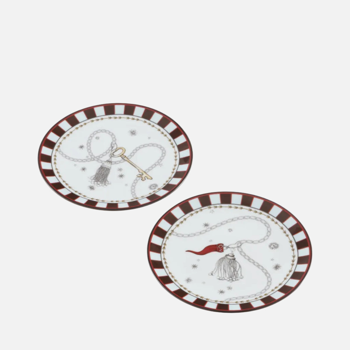 Two decorative oval plates with a white center, brown and white striped rims, and whimsical western-themed illustrations including a lasso, key, and hat, shown on a white background.