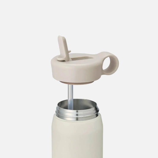 Cream-colored travel mug with a lid on a white background