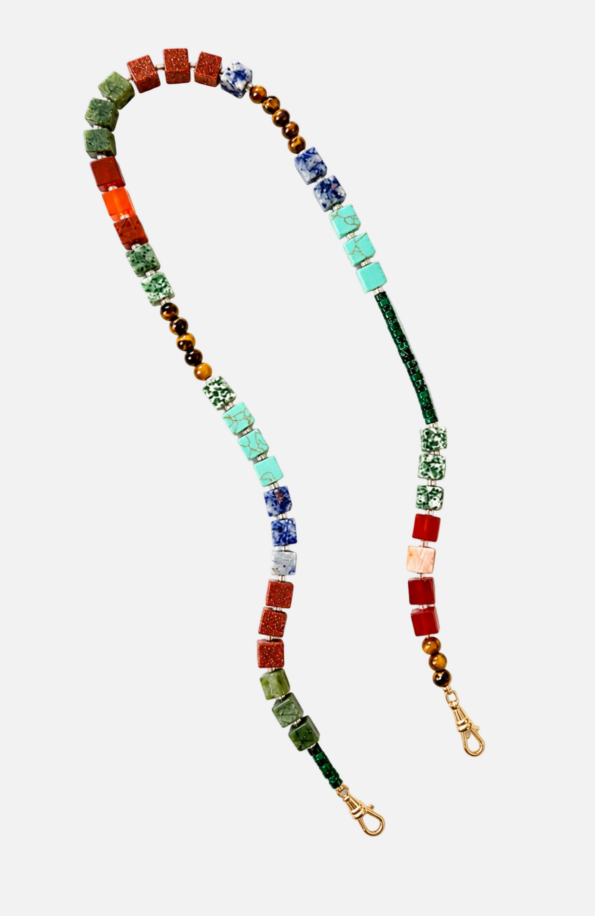 A beaded necklace featuring a multicolor sequence of stone beads, including red, green, turquoise, blue, and brown, with gold-toned lobster clasps at the ends, displayed on a clean white background.