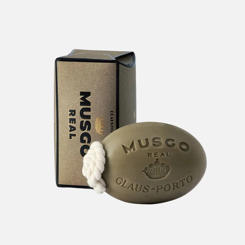 Bar of Musgo Real Claus Porto soap with packaging on a white background