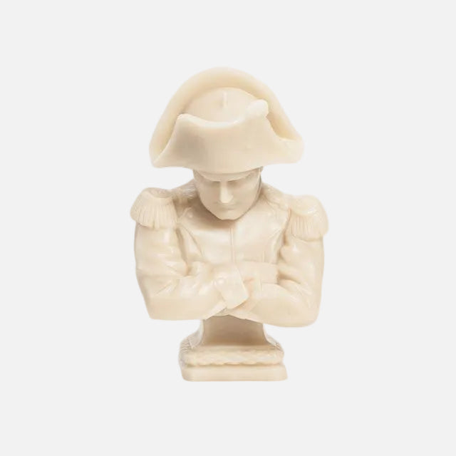 Ivory sculpture of a figure wearing a hat on a white background