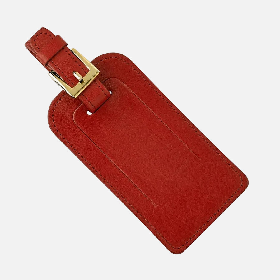 Red luggage tag with gold accent on a white background