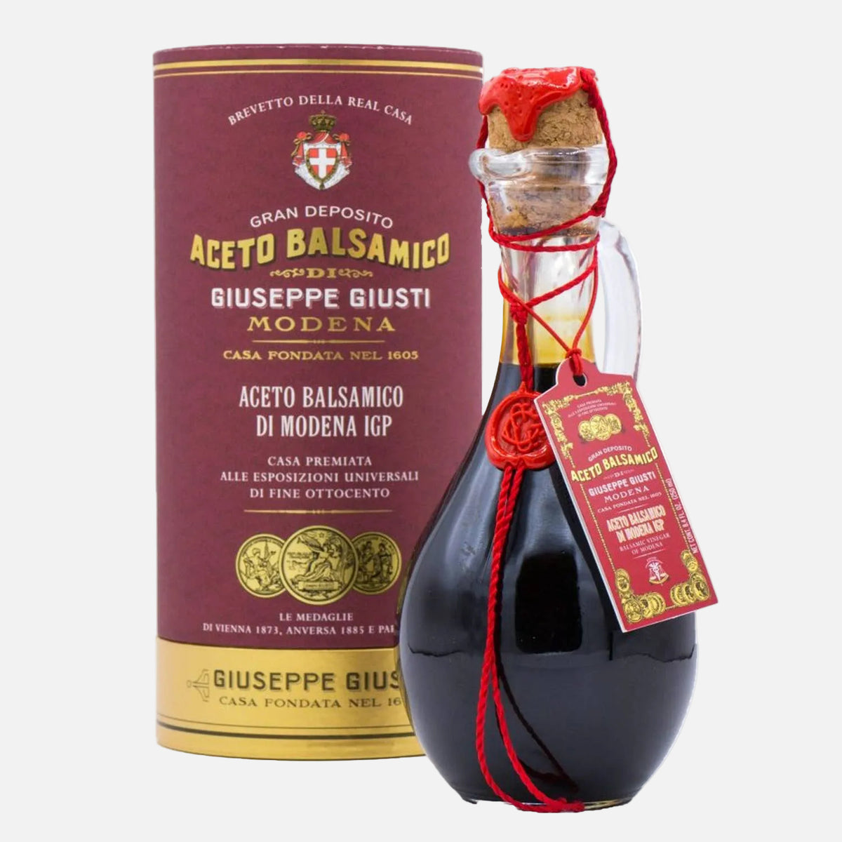Balsamic vinegar bottle with packaging and tag on a white background