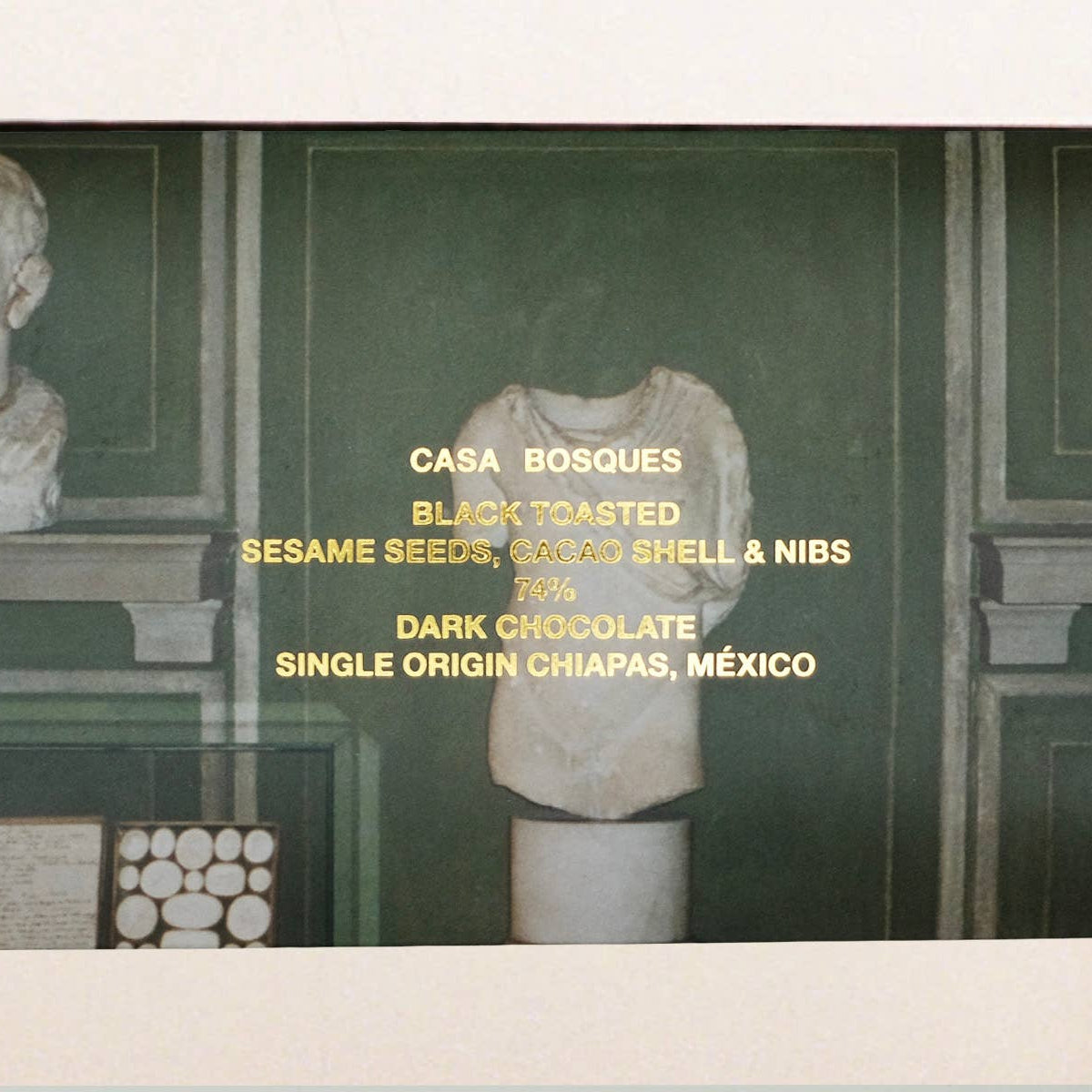 Product packaging with text and a classical sculpture in the background