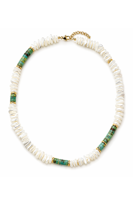 Necklace with white beads and green accents on a white background