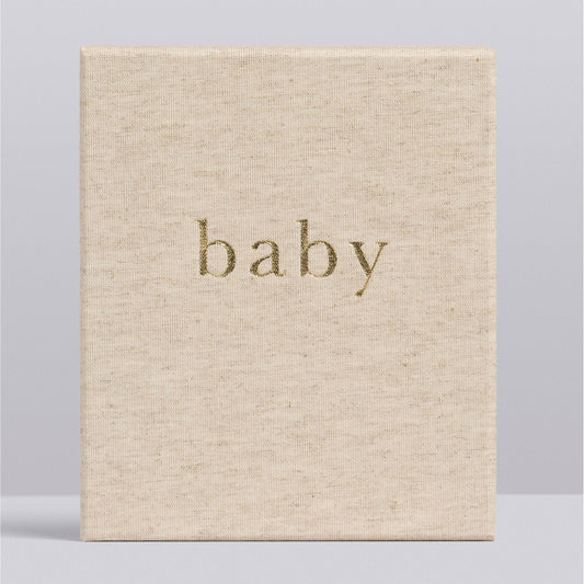 Beige book with 'baby' embossed on the cover against a light gray background