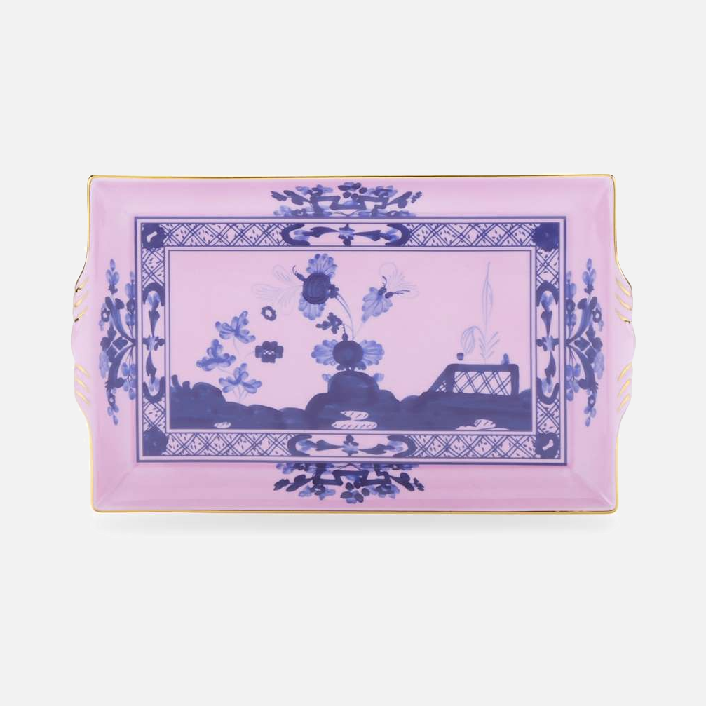 Oriente Italiano rectangular tray with handles in Azalea, a pink porcelain tray with a hand-painted blue chinoiserie garden scene and gold trim.