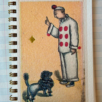 Notebook with a vintage-style illustration of a person and dog on the cover