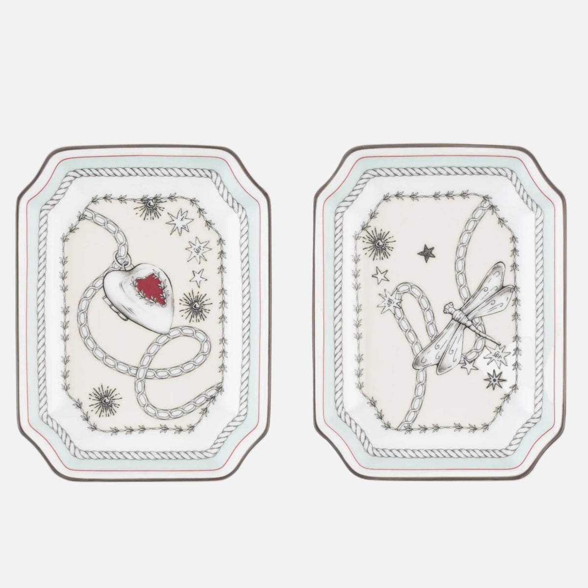 Three small rectangular decorative plates with rounded corners, arranged side by side on a white background. Each plate has a white base with delicate gray illustrated line art and a tiny red accent in the center of the left plate.
