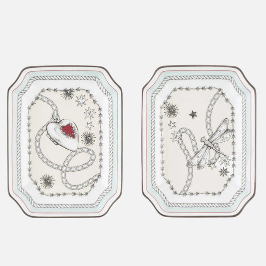 Three small rectangular decorative plates with rounded corners, arranged side by side on a white background. Each plate has a white base with delicate gray illustrated line art and a tiny red accent in the center of the left plate.