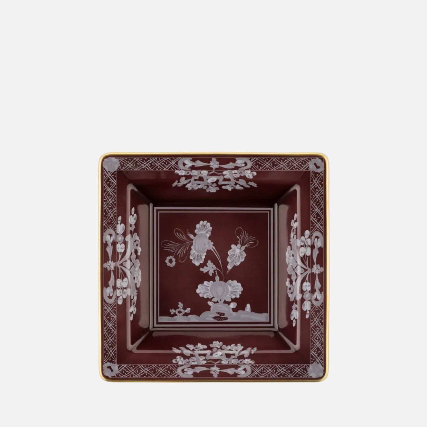 A square ceramic ashtray with a deep burgundy red interior, featuring white floral and bird motifs in the center and a white ornamental border, finished with a thin gold rim, shown on a plain white background.