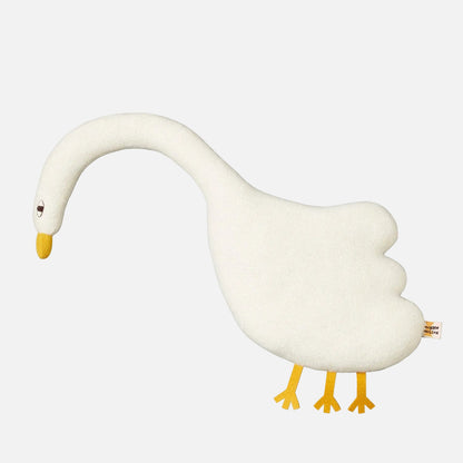 White goose-shaped pillow with yellow feet and beak on a white background