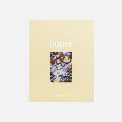 Book titled 'Butter' with images of butter dishes on a beige cover