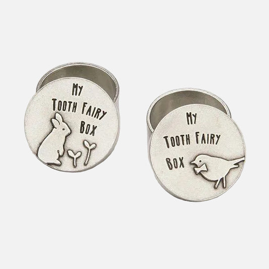Two round silver tooth fairy boxes with engraved designs on a white background