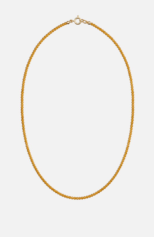 Gold necklace on a white background