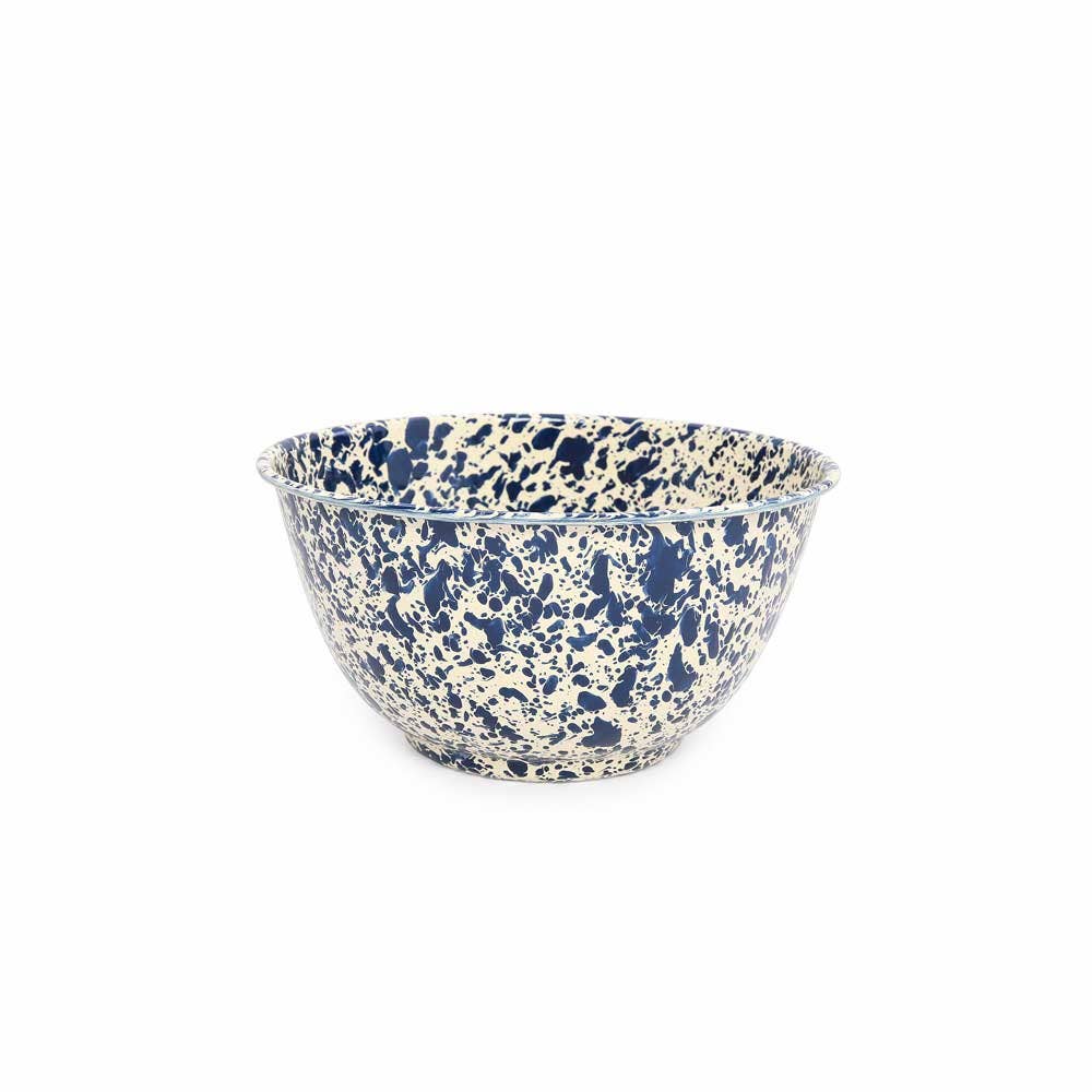 Speckled blue and beige ceramic bowl on a white background