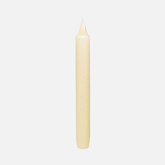 Champagne candle on a light gray background