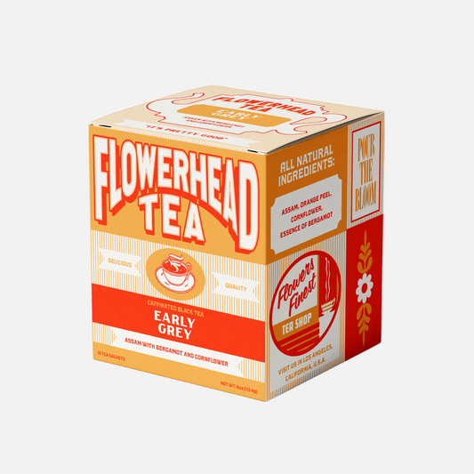 Box of Flowerhead Tea with orange and white design on a white background