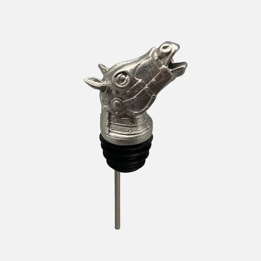 Metallic horse-shaped wine bottle stopper on a white background