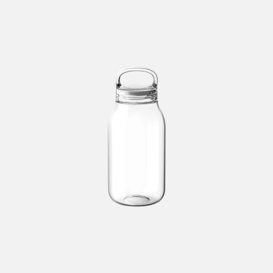 Clear glass bottle with a metal cap on a white background