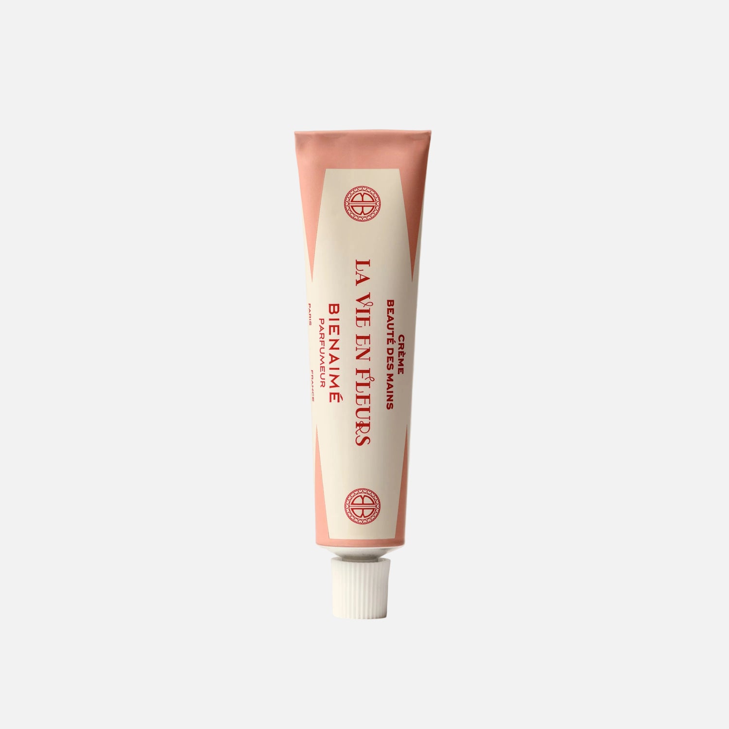 Tube of 'La Vie en Rose' hand cream on a light gray background