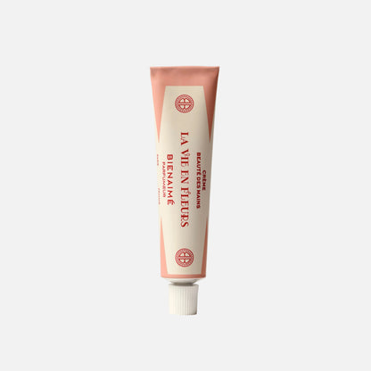 Tube of 'La Vie en Rose' hand cream on a light gray background