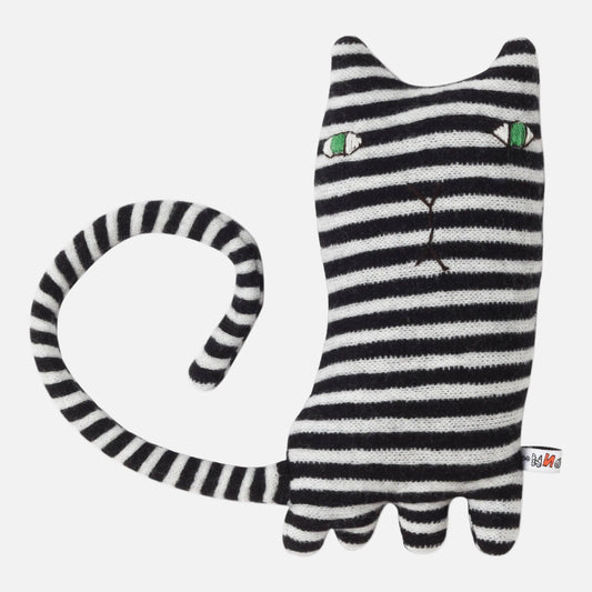 Black and white striped cat-shaped toy with green eyes on a white background