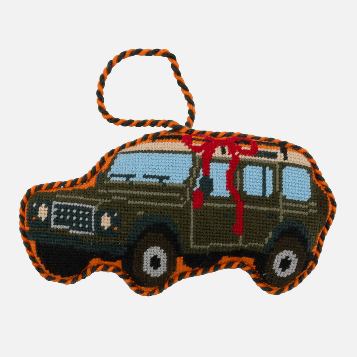 Embroidered toy truck with orange accents on a white background