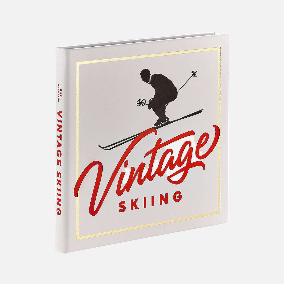 Book titled 'Vintage Skiing' with a skier silhouette on a white background