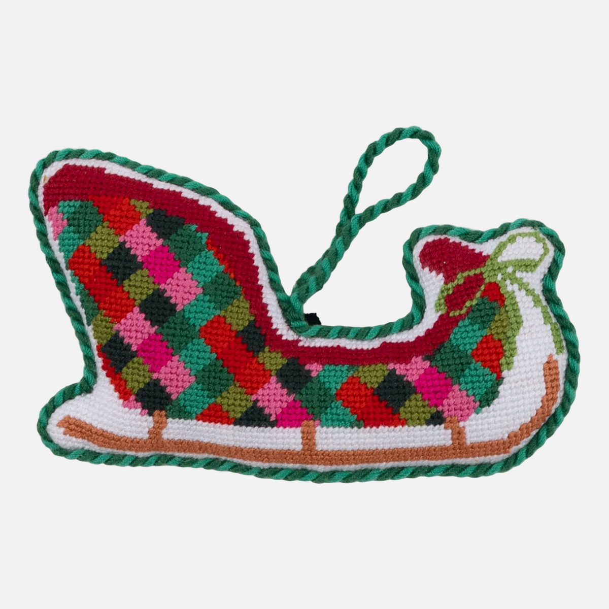 Colorful woven dog toy shaped like a boat on a white background