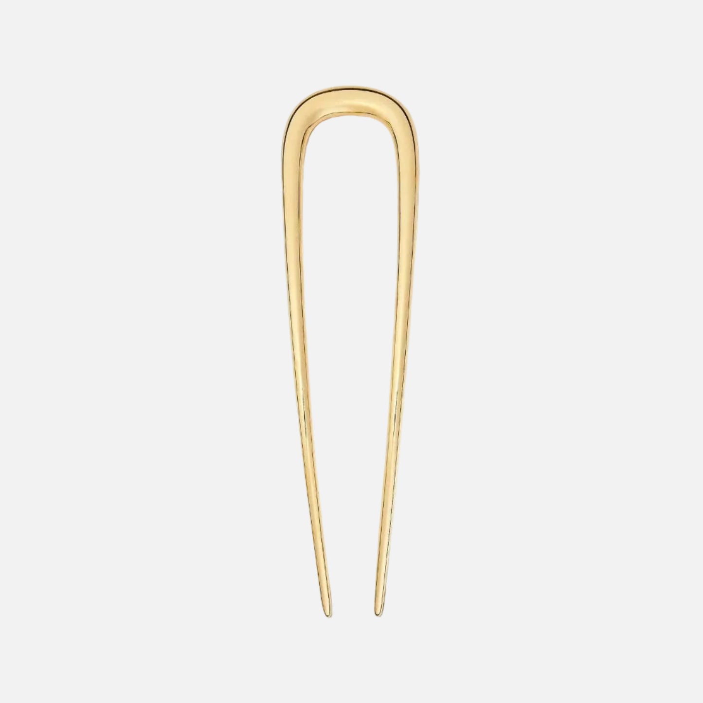 Gold hairpin on a white background