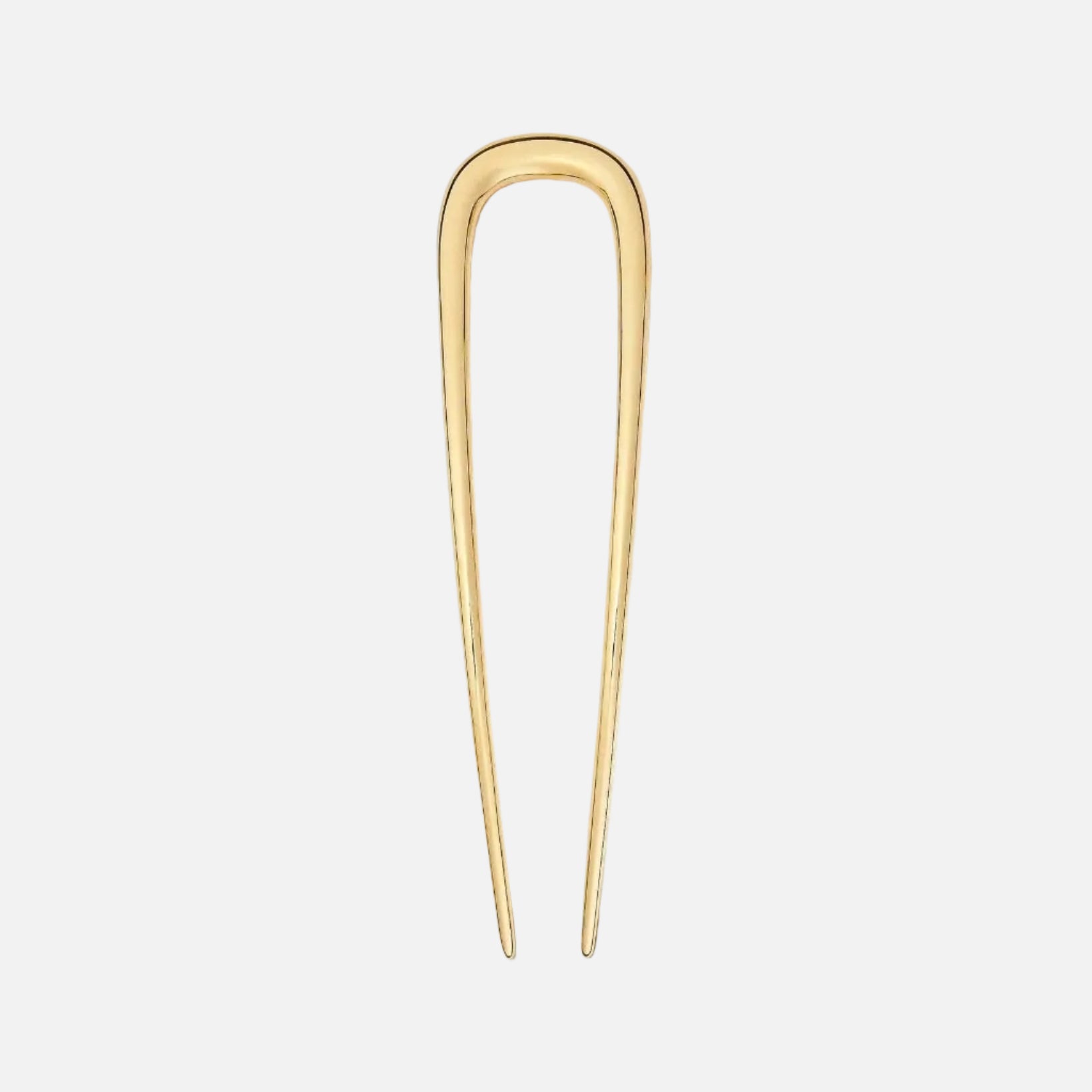 Gold hairpin on a white background