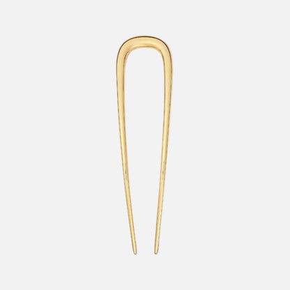Gold hairpin on a white background