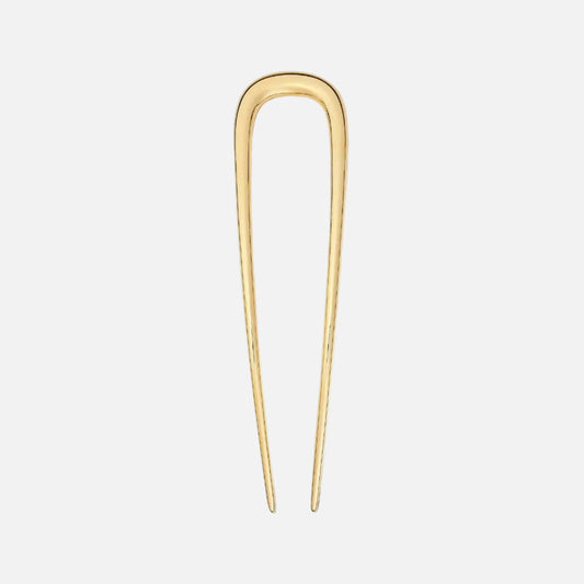Gold hairpin on a white background