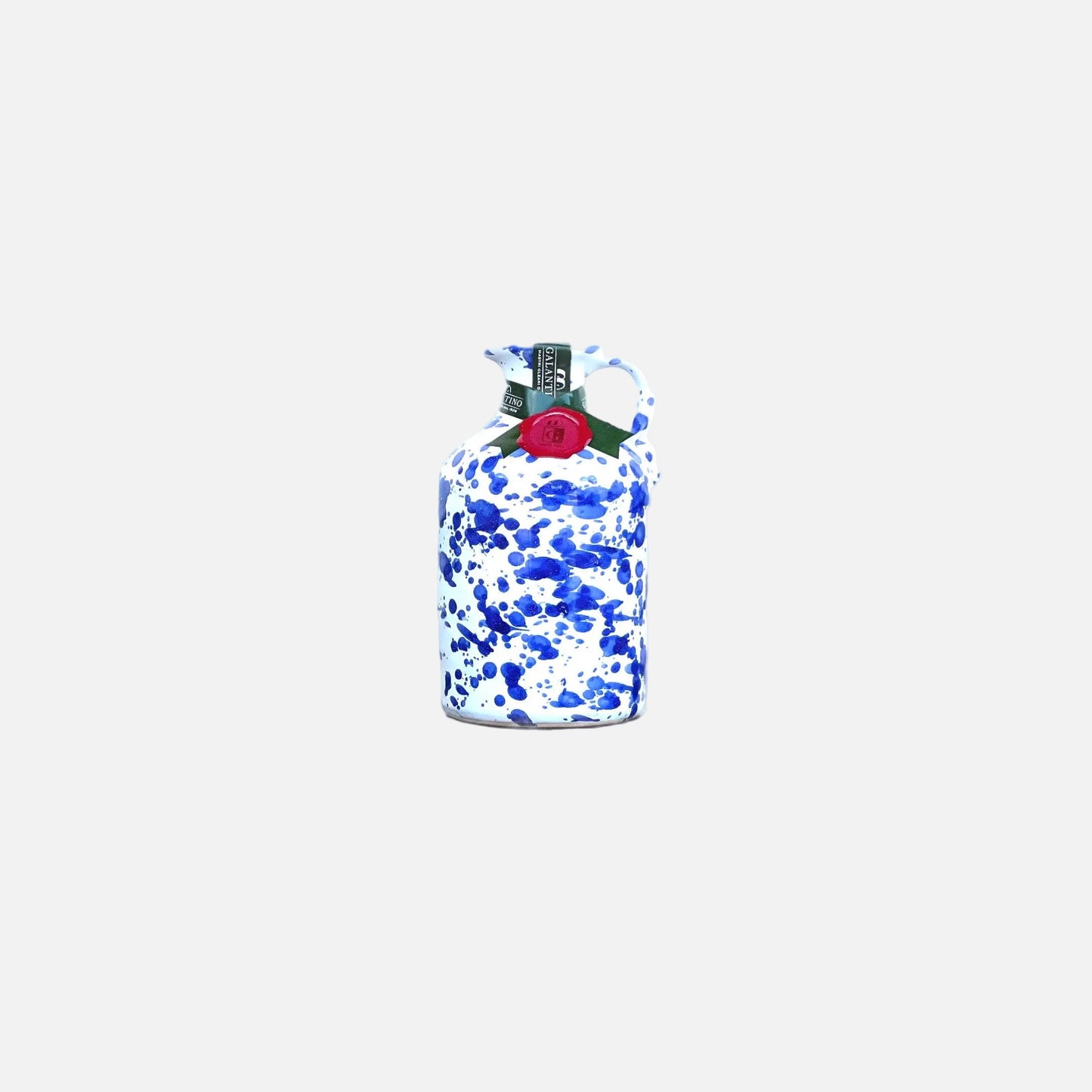 Blue and white camouflage-patterned bottle with a red cap on a white background