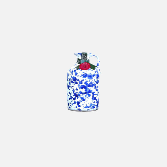 Blue and white camouflage-patterned bottle with a red cap on a white background