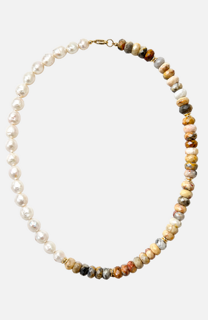 Necklace with pearls and multicolored beads on a white background