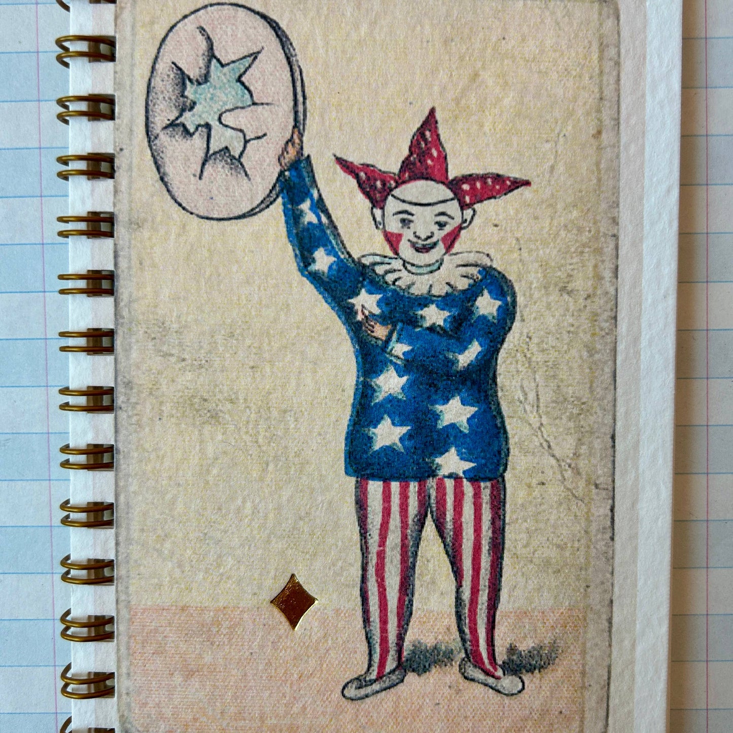 Notebook with a clown illustration on a textured surface