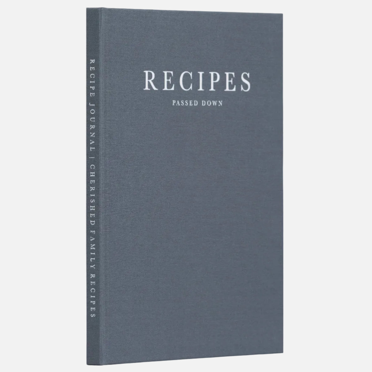 A hardcover recipe journal titled 'Recipes: Passed Down' in a muted slate blue-gray color, standing upright on a light gray surface against a neutral gray background.