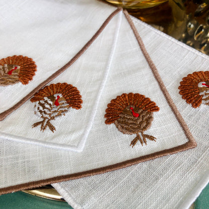 Set of 4 Thanksgiving Embroidered Turkey Cocktail Napkins: Light brown hem