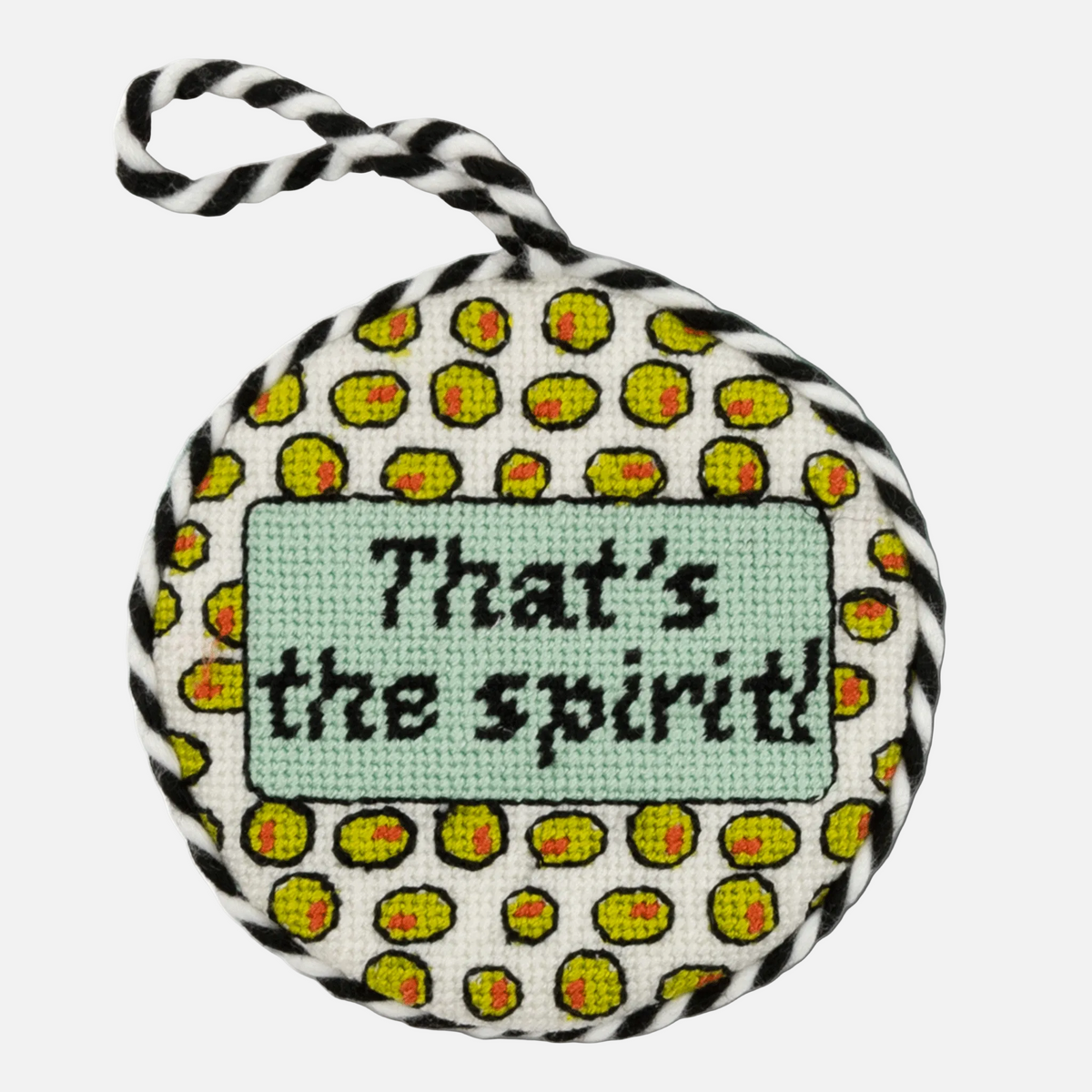 Round dog toy with patterned exterior and 'That's the spirit!' text on a white background
