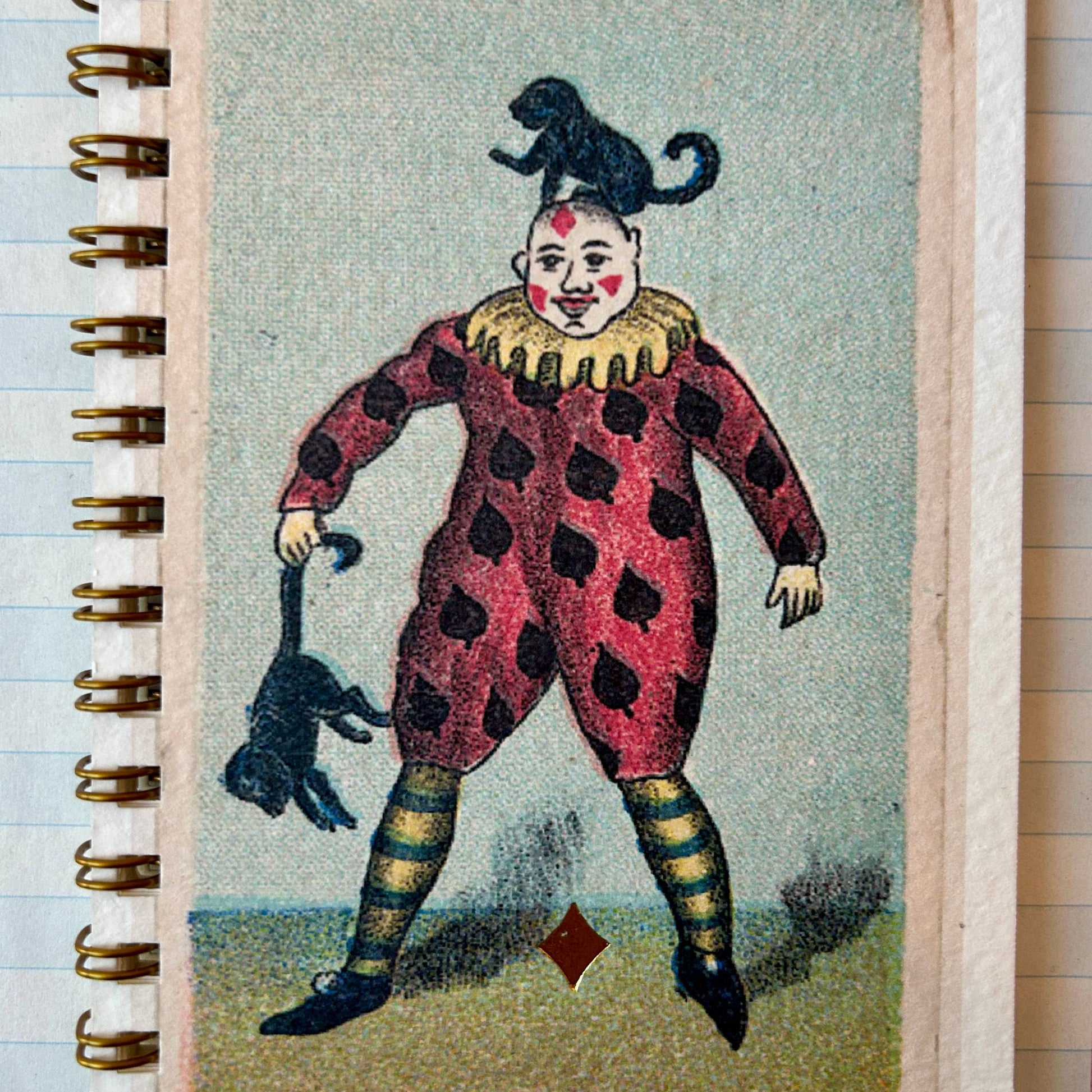 Notebook with a vintage-style clown illustration on the cover