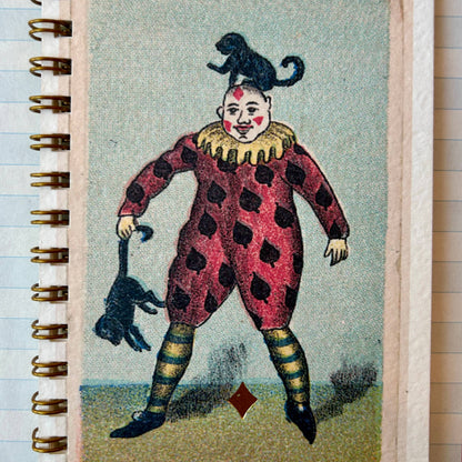 Notebook with a vintage-style clown illustration on the cover