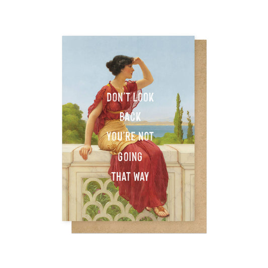 Greeting card with a classical painting of a woman in a red dress sitting on a ledge, with text 'Don't look back you're not going that way'.