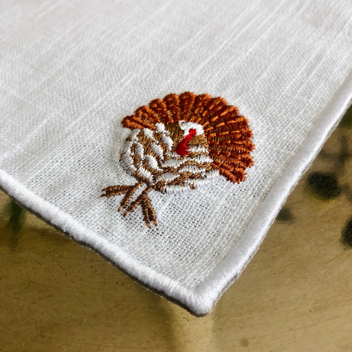 Set of 4 Thanksgiving Embroidered Turkey Cocktail Napkins: Light brown hem