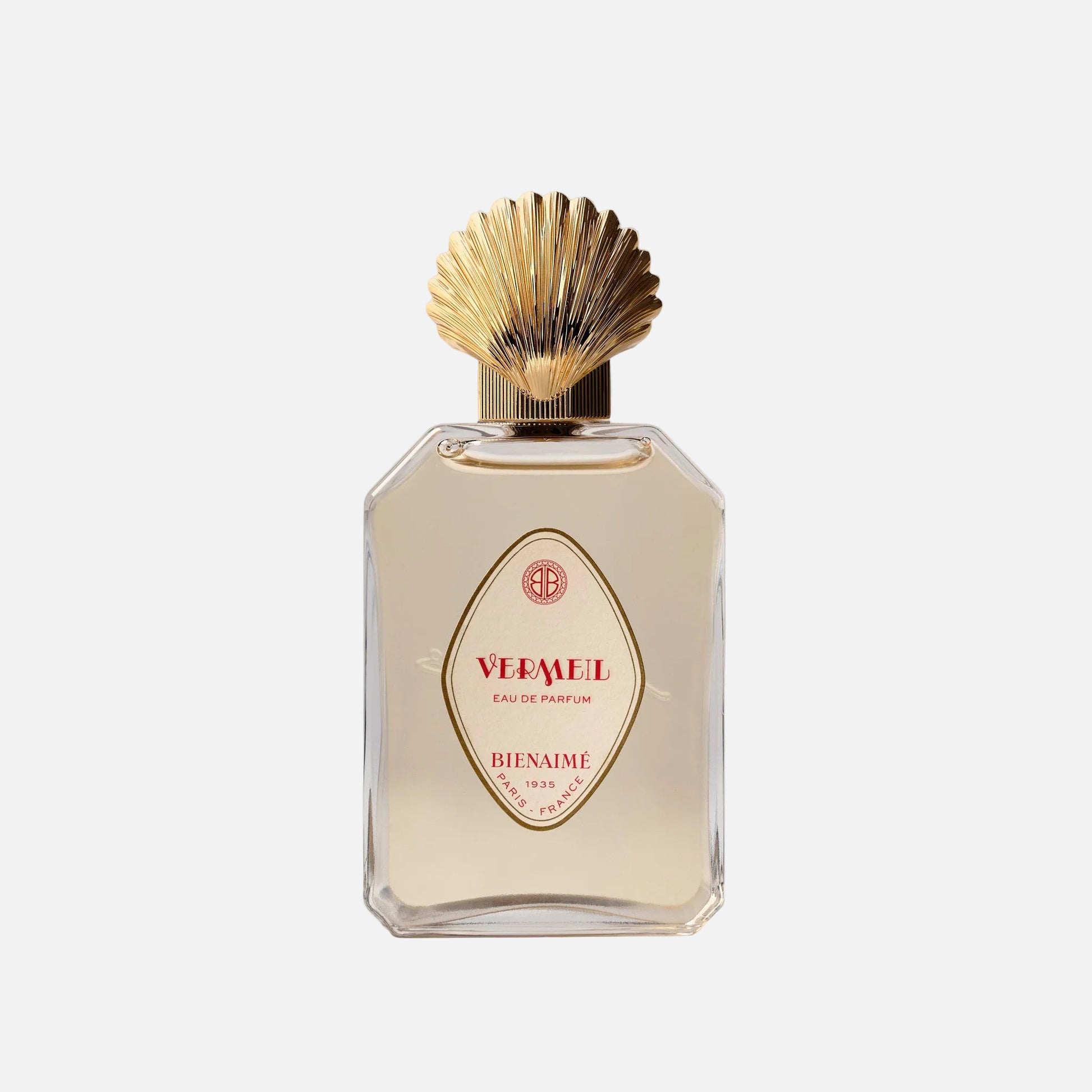 Perfume bottle with gold cap on a light background