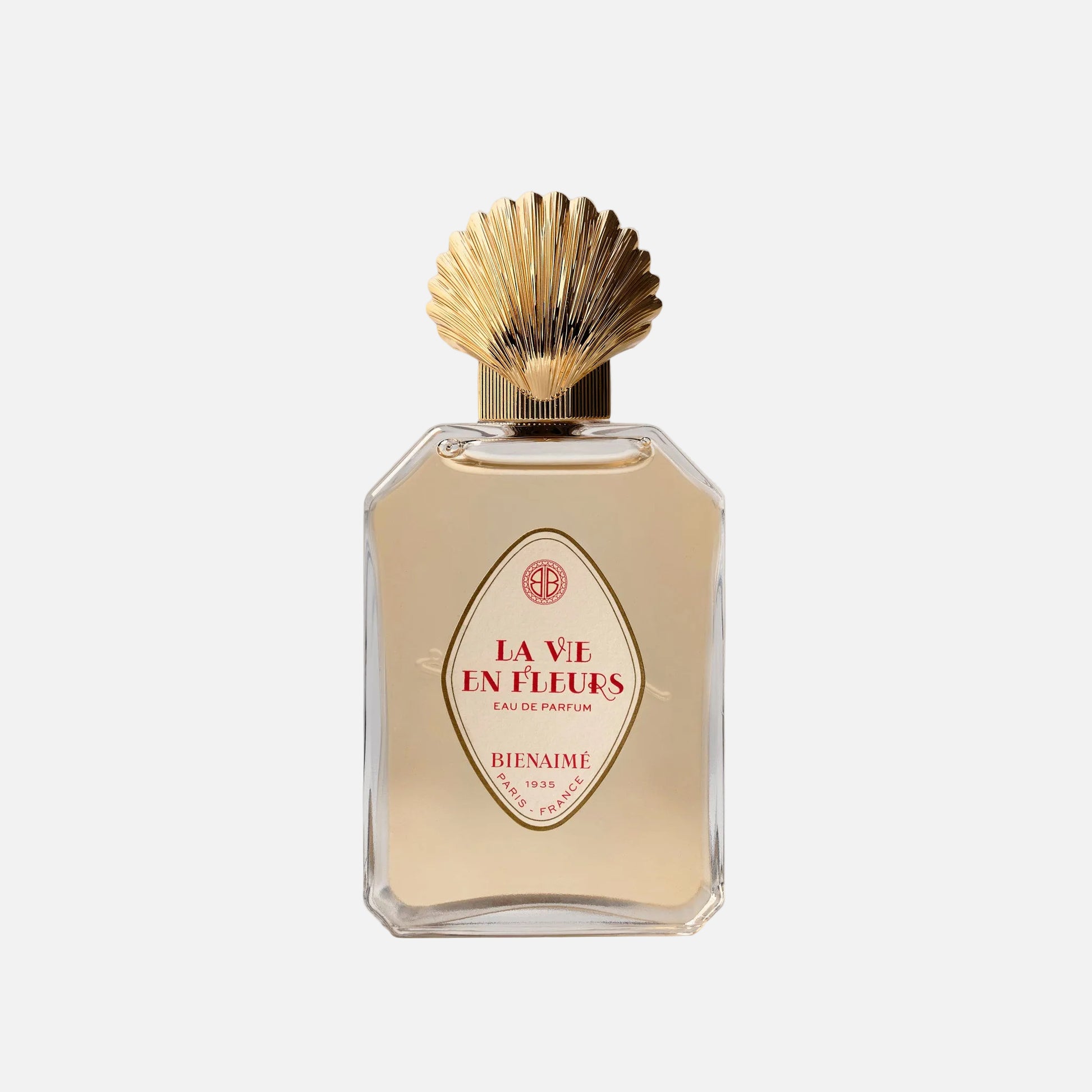 Perfume bottle with gold cap on a light background